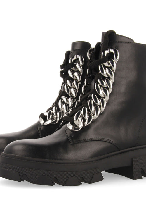 Holzthum women's black lace-up combat boots with track soles and maxi chains