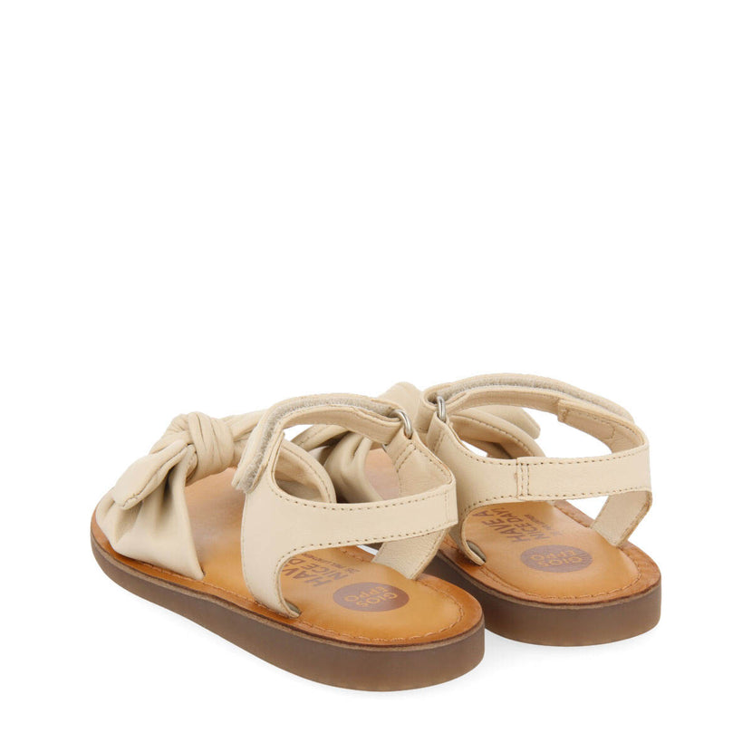 Sandali in pelle metallizzata in color off-white da bambina stigny