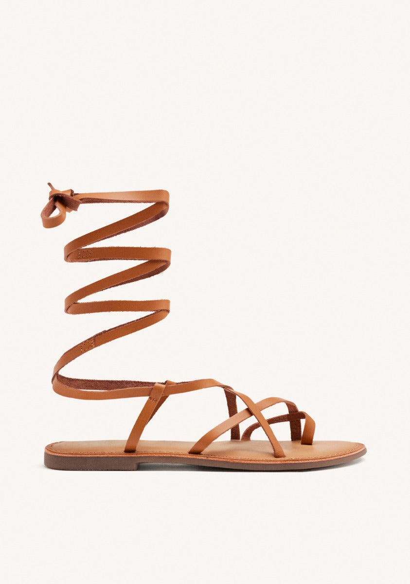 Lussat sandals with thin tan straps to tie around the leg