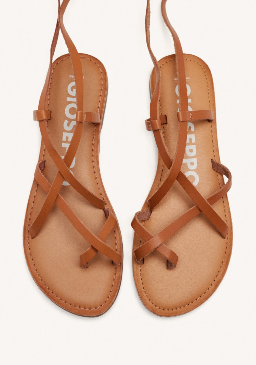 Lussat sandals with thin tan straps to tie around the leg