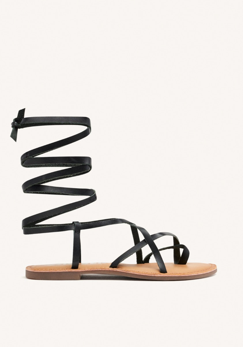 Lussat sandals with thin black straps to tie around the leg