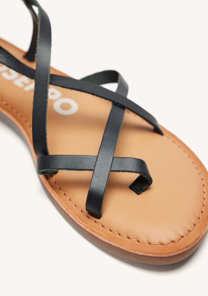 Lussat sandals with thin black straps to tie around the leg