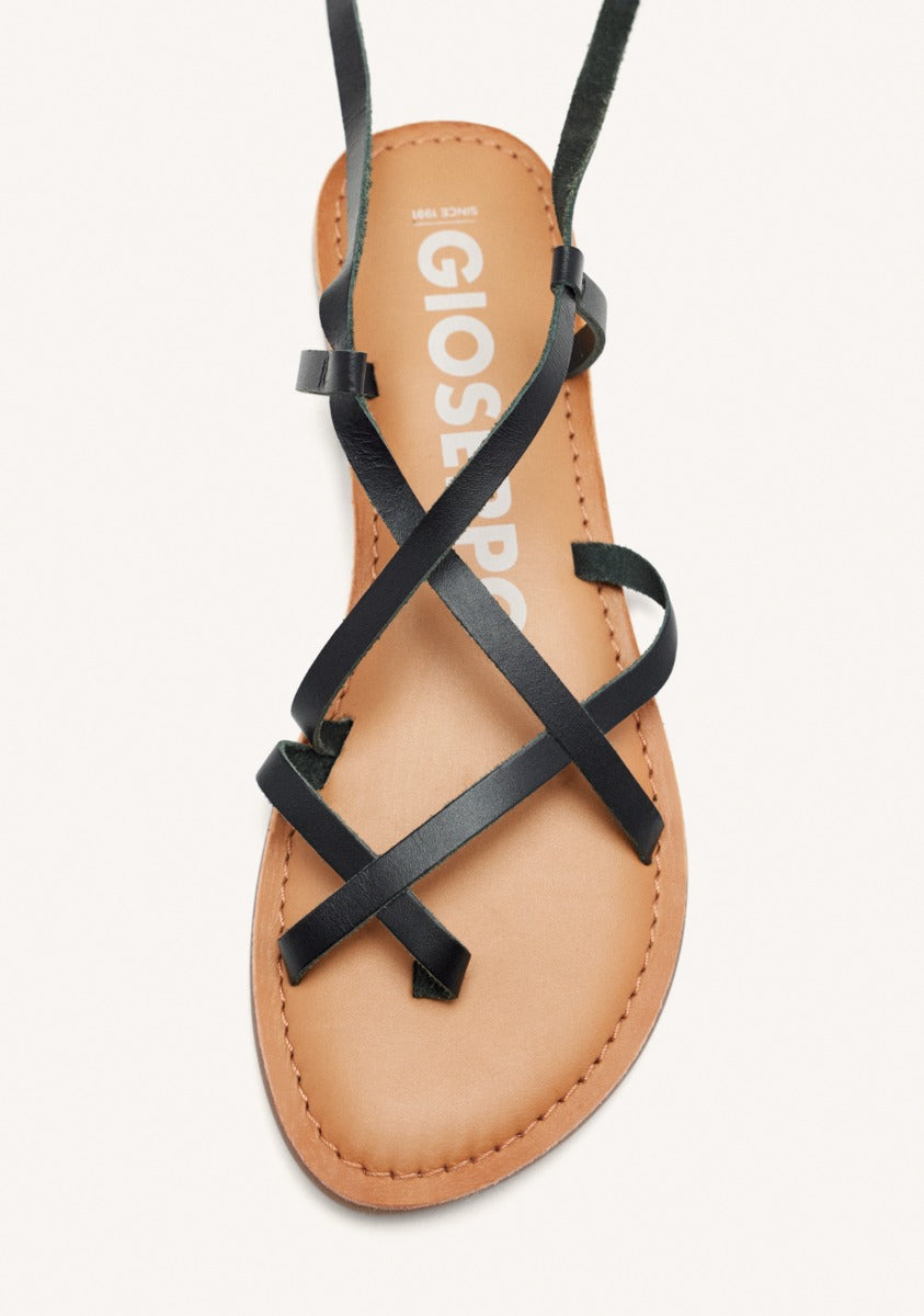 Lussat sandals with thin black straps to tie around the leg