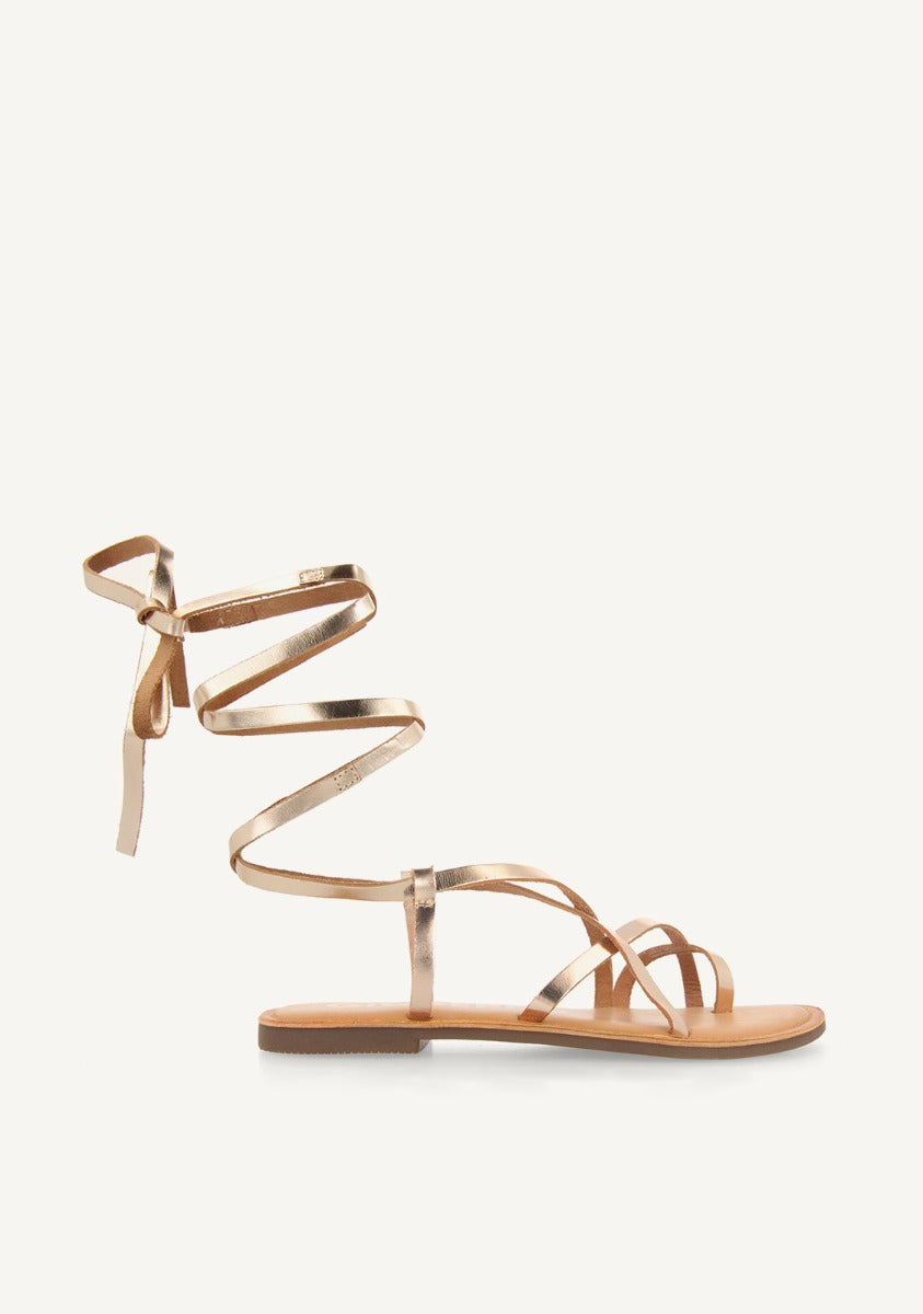 Lussat sandals with thin gold straps to tie around the leg