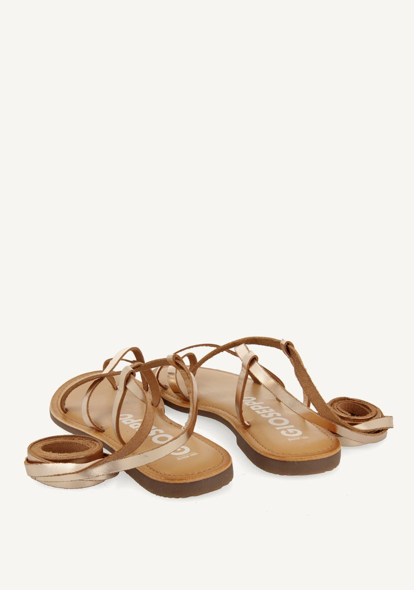 Lussat sandals with thin gold straps to tie around the leg