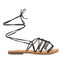 Mambai women's flat black leather sandals with thin straps and decorative knots