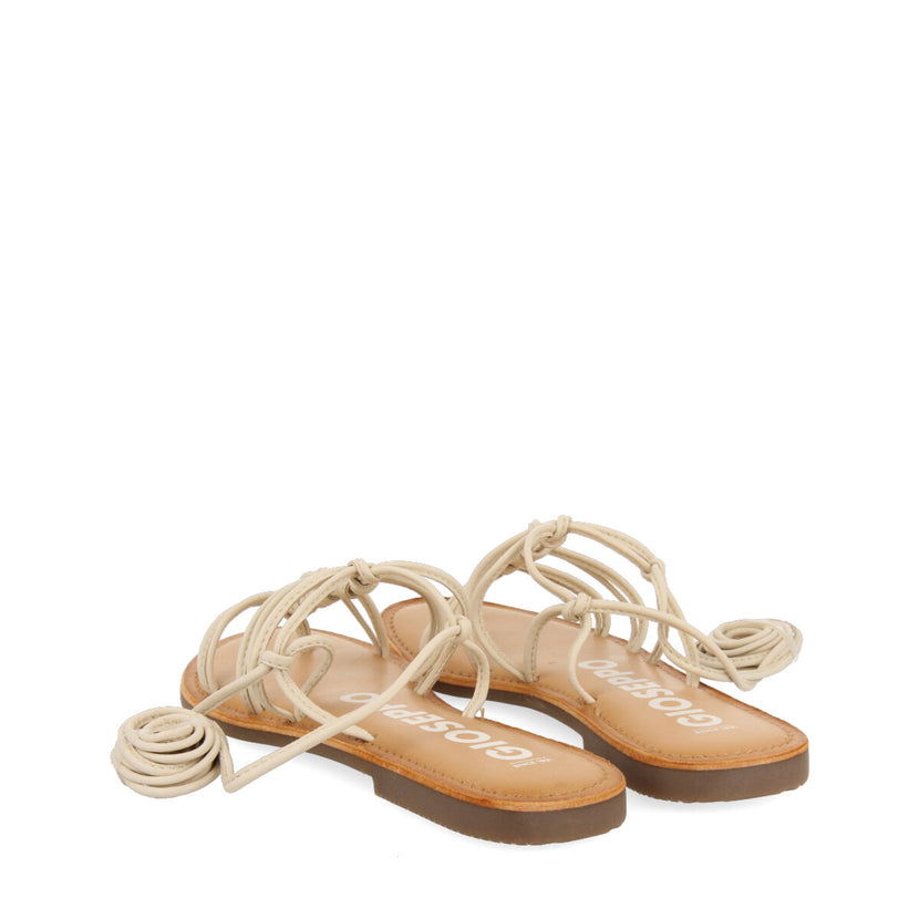 Sandalias planas de piel off-white con tiras finas y detalle de nudos para mujer mambai 
