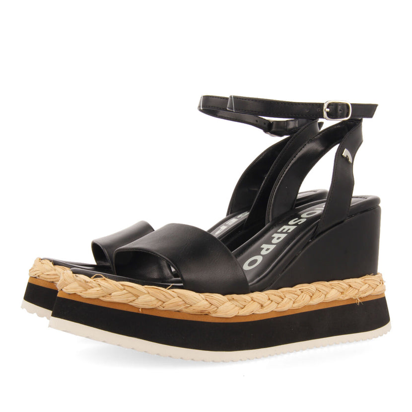 Sandalias color negro con cuña y detalle trenzado para mujer arniquet 