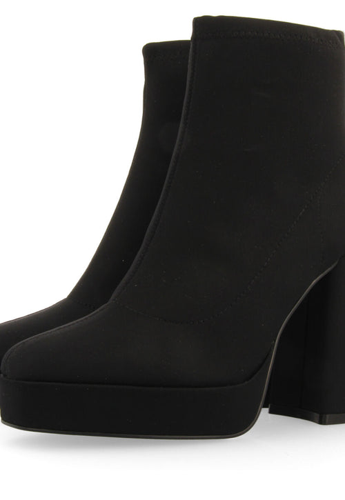 Turenki women's black ankle boots with wide heels and platforms