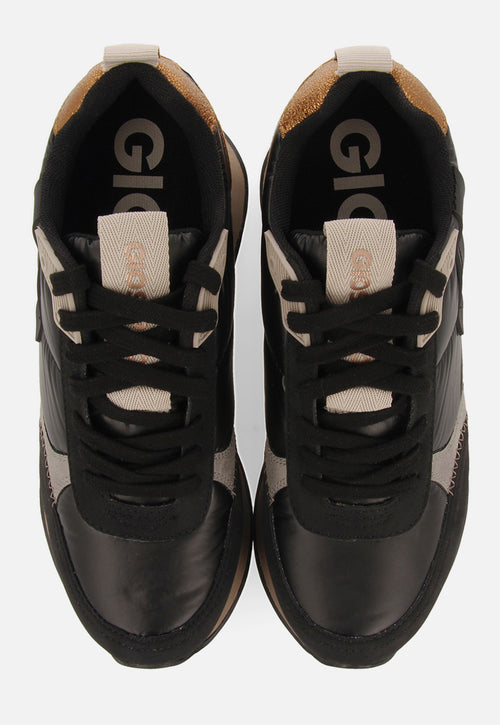 Sneakers noires monochromes rembourrées ornées de détails et talonnette invisible pour femme anif 