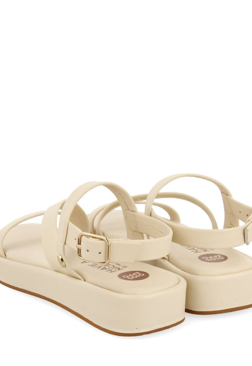 SANDALIAS COLOR OFF-WHITE DE PIEL CON TIRAS Y SUELA CON VOLUMEN PARA NIÑA Y NIÑO COULEE