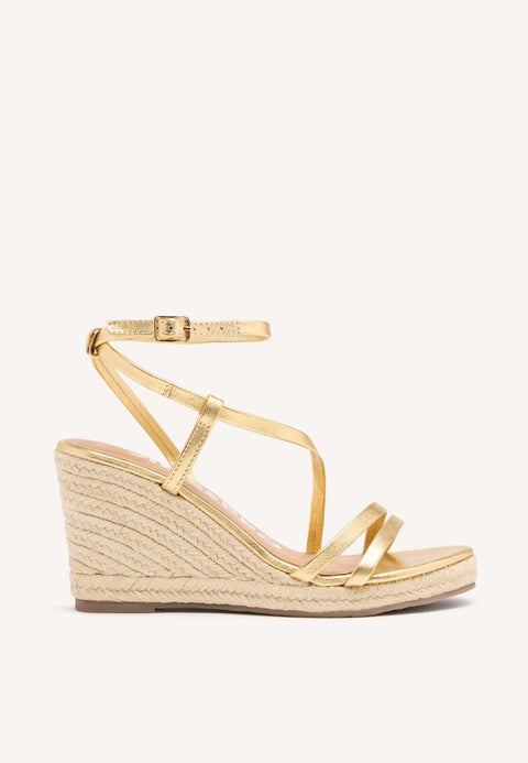 SANDALIAS DORADAS DE PIEL CON TIRAS Y CUÑA ALTA DE YUTE PARA MUJER ORIKUM