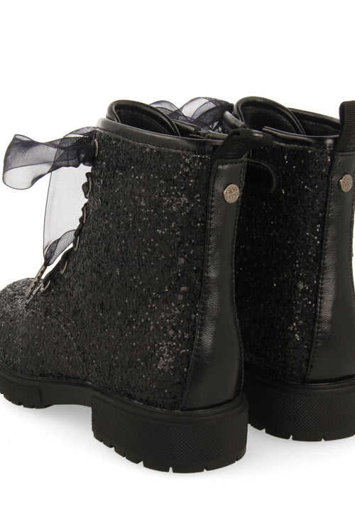 SEQUINED BOOTS AND TULLE SURANY