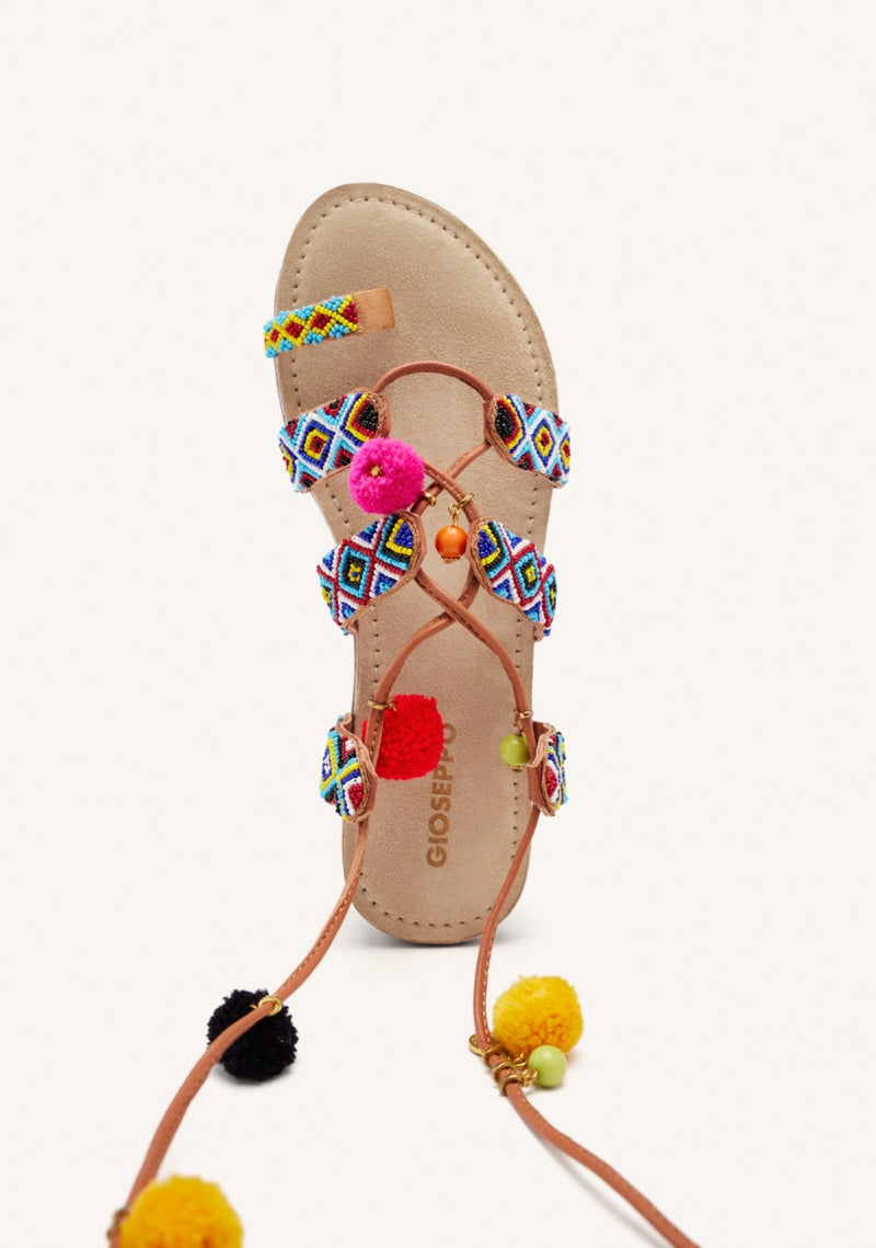 SANDALIAS PIEL ABALORIOS Y POMPONES DYANI