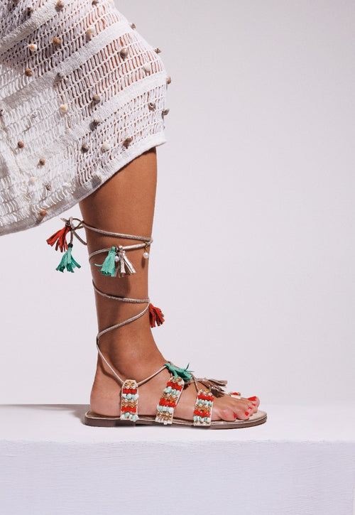 LEATHER SANDALS WITH FRINGES AND BEADS NUBO