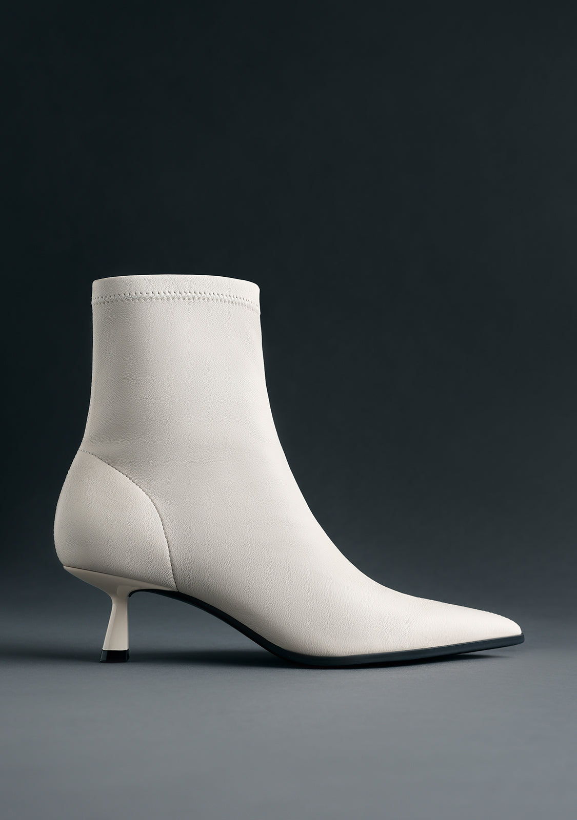 OFF-WHITE LEATHER ELASTIC ANKLE BOOTS BY MELYSSA PINTO